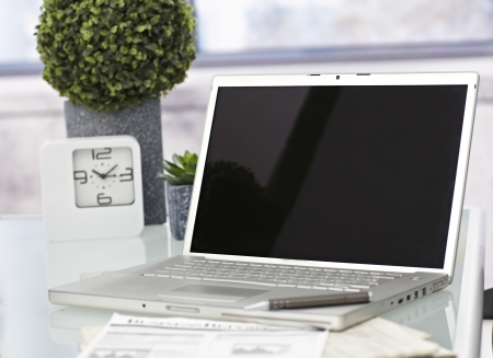 Closeup photo of laptop computer with open top. Blank screen.の写真素材