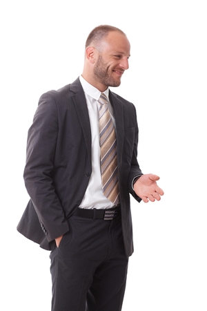 Happy businessman turning left, talking, gesturing, smiling.の写真素材