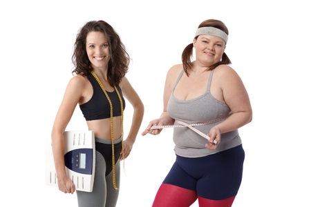 Overweight and slim women having diet together to be fit and healthy.の写真素材
