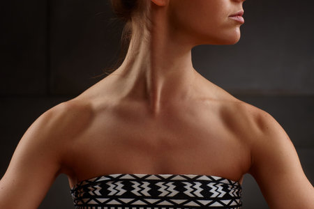 Closeup photo of bare female shoulder and neck.の写真素材