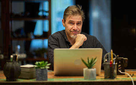 Man working with laptop at home officeの写真素材