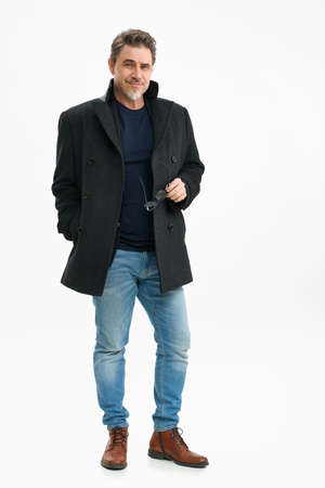 Portrait of happy smiling mid adult man on whiteの写真素材