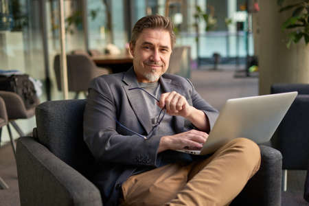Businessman working online with laptopの写真素材