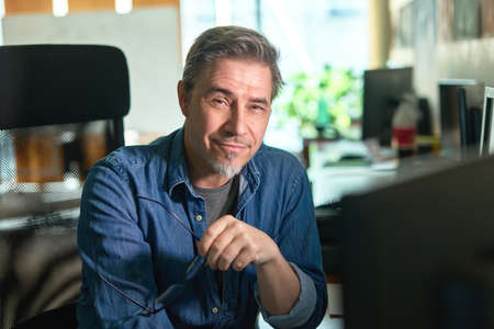 Casual man working with computer in officeの写真素材