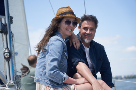 Couple on sailing boat enjoying vacation travel