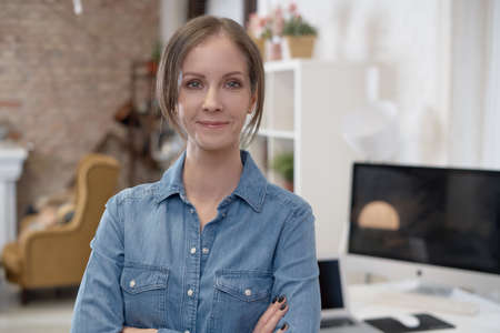 Portrait of happy young woman at homeの写真素材