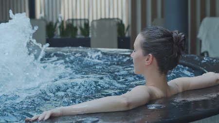 Wellness - woman in spa in hot tubeの写真素材