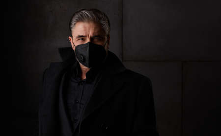 Portrait of older man in 50s wearing face maskの写真素材