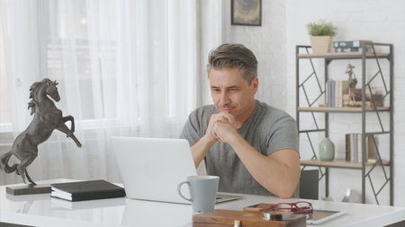 Man working from home with computerの写真素材