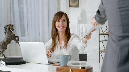 Business woman working on computer in home officeの写真素材