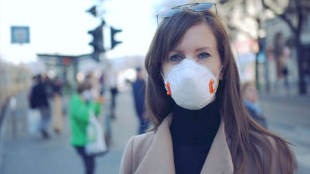 Woman in face mask coronavirus covid-19 protectionの写真素材