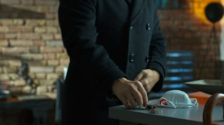 Man leaving home getting virus protection maskの写真素材