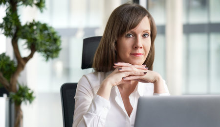Portrait of white businesswoman in office