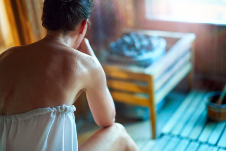 Wellness . woman sweating in saunaの写真素材