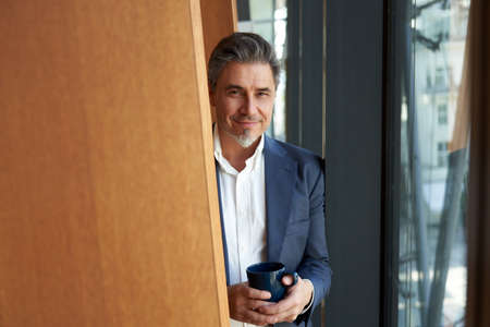Businessman in office coffee breakの写真素材