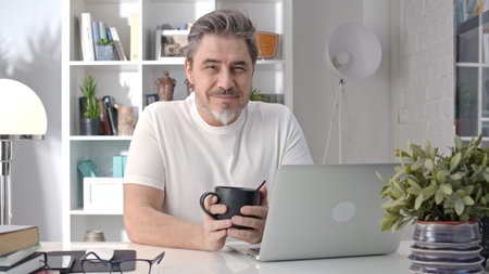 Middle aged man working with computer at home