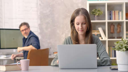 Business people working in office with computerの写真素材