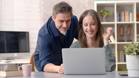 Business people working in office with laptopの写真素材
