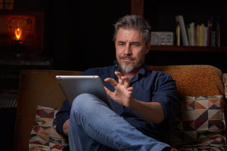Man working with tablet in home office