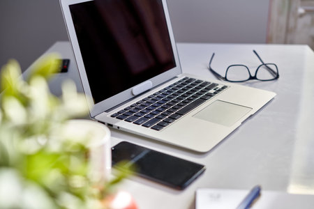 Home office desk with laptop computer