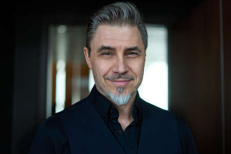 Portrait of businessman - happy man in officeの写真素材