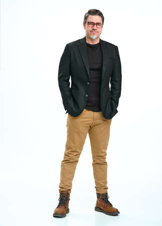 Portrait of happy smiling mid adult businessman on whiteの写真素材