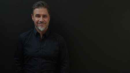 Confident businessman smiling. Portrait of mature age, middle age, mid adult man in 50s, happy confident smile. Copyspace.の写真素材