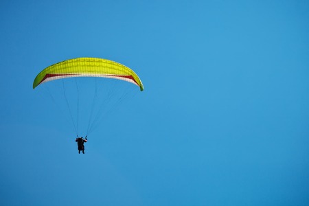 Paragliding along the beautiful coastline. Beautiful summer background. Sport.の写真素材
