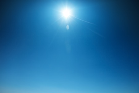 Beautiful summer sky with bright sun. The natural background.の写真素材