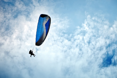 Paragliding along beautiful coastline.の写真素材