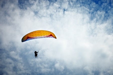 Paragliding along beautiful coastline.の写真素材