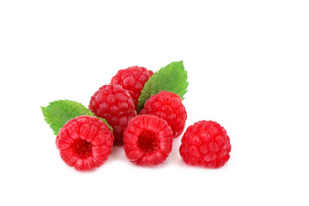 Tasty ripe raspberries on a white background.