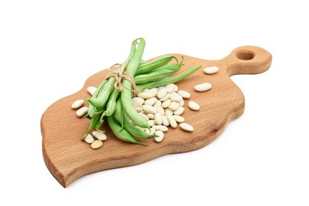 White beans and green beans on a cutting Board.の写真素材
