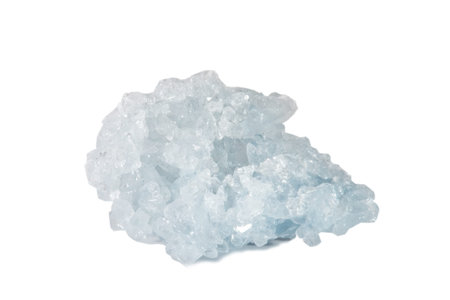 Macro shooting of natural gemstone. The raw mineral is Celestine, Madagascar. Isolated object on a...