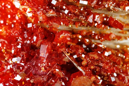 Macro shooting of natural gemstone. Texture of mineral vanadinite. Abstract background.の写真素材