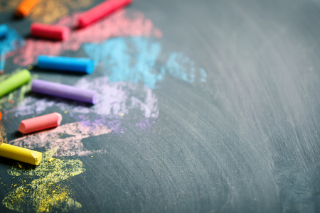 Colorful crayons on the blackboard, drawing. Back to school background.の写真素材
