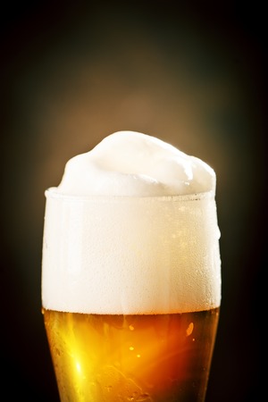 A glass of beer on a dark background. Oktoberfest. Beer festival. Selective focus. Background with copy space.の写真素材