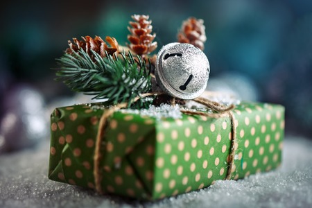 Merry Christmas and happy New year. Christmas gift and Christmas tree on dark wooden background.の写真素材