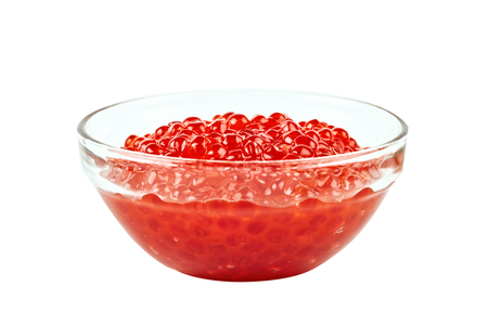 Red caviar in a glass container. Isolated object on white background.の写真素材