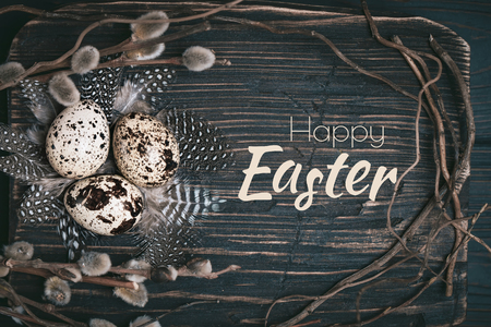 Happy Easter. Congratulatory easter background. Easter eggs and flowers. Selective focus.の写真素材