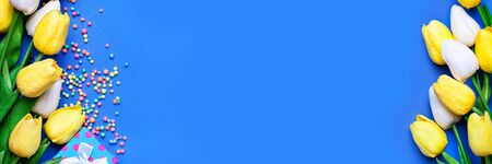 Background of spring flowers for card for the holiday. Womens Day. Selective focus. Horizontal. Top view. Background with copy space.の写真素材