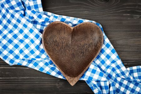 Blue checkered tablecloth and wooden appliances for cooking and baking. Background with copy space. Horizontal.の写真素材