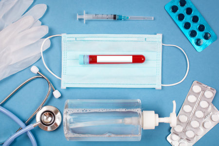 Medical masks, medical gloves, disinfectants and gloves on the table. Coronavirus, Covid-19...
