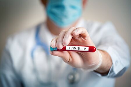 The epidemic of coronavirus. The doctor keeps a blood test. Background with copy space. Horizontal.の写真素材