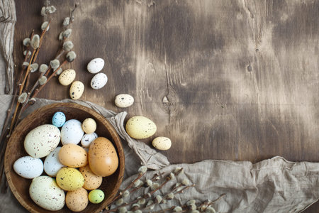 Congratulatory easter background. Easter eggs and flowers. Selective focus. Top view. Background...
