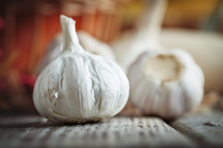 Garlic on a wooden table. Autumn background. Selective focus.の写真素材