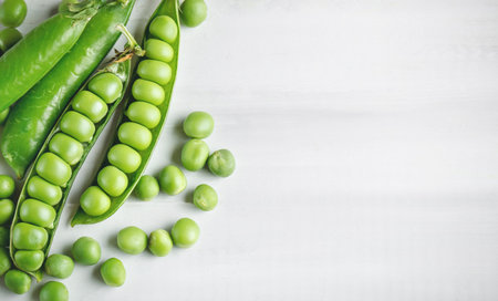 Fresh green peas in pods. Horizontal background. Background with copy space. Horizontal. Top view.