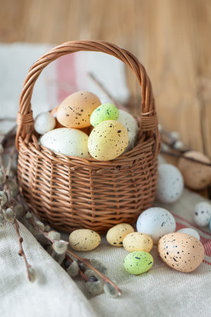 Congratulatory easter background. Easter eggs and flowers. Selective focus. Top view.
