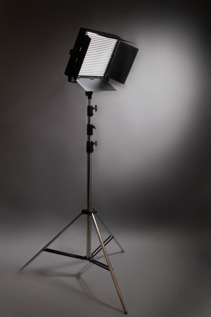 studio flash throwing a spotlight on the wallの写真素材