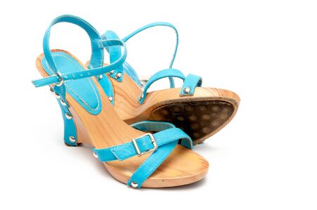 The pair of turquoise woman's shoes isolated on white background 